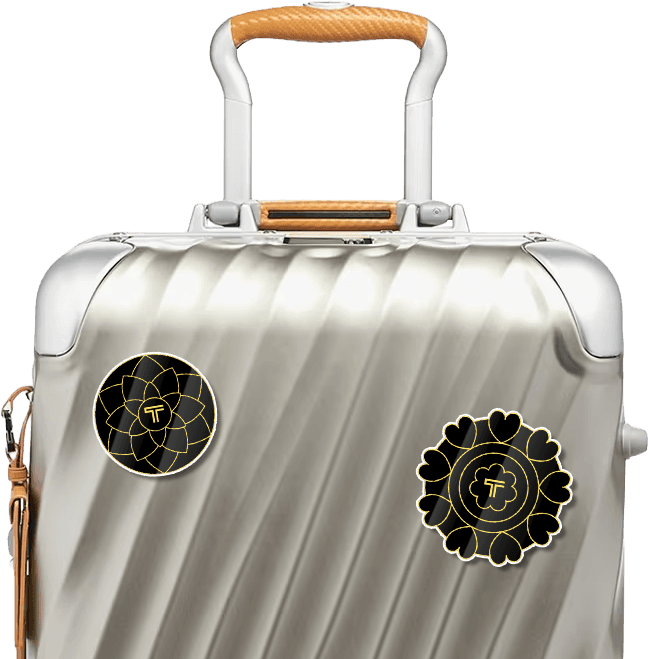 TUMI Diwali sticker medallions on suitcase